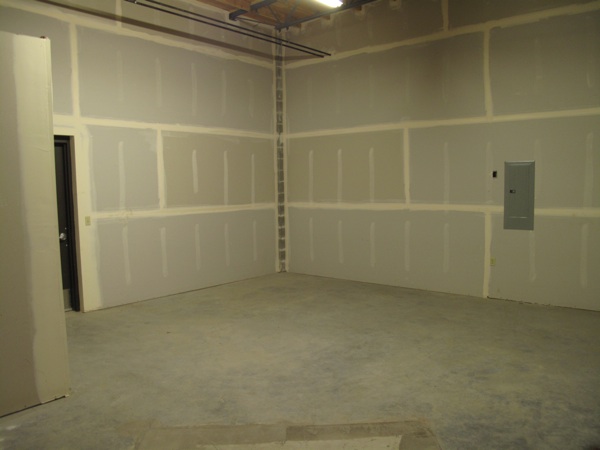 This is the wall in the back that will have an archway into the other space, where the food room will be